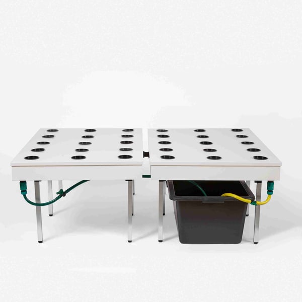 G-Tools Flow hydroponics grow system with net cups on an aluminium table
